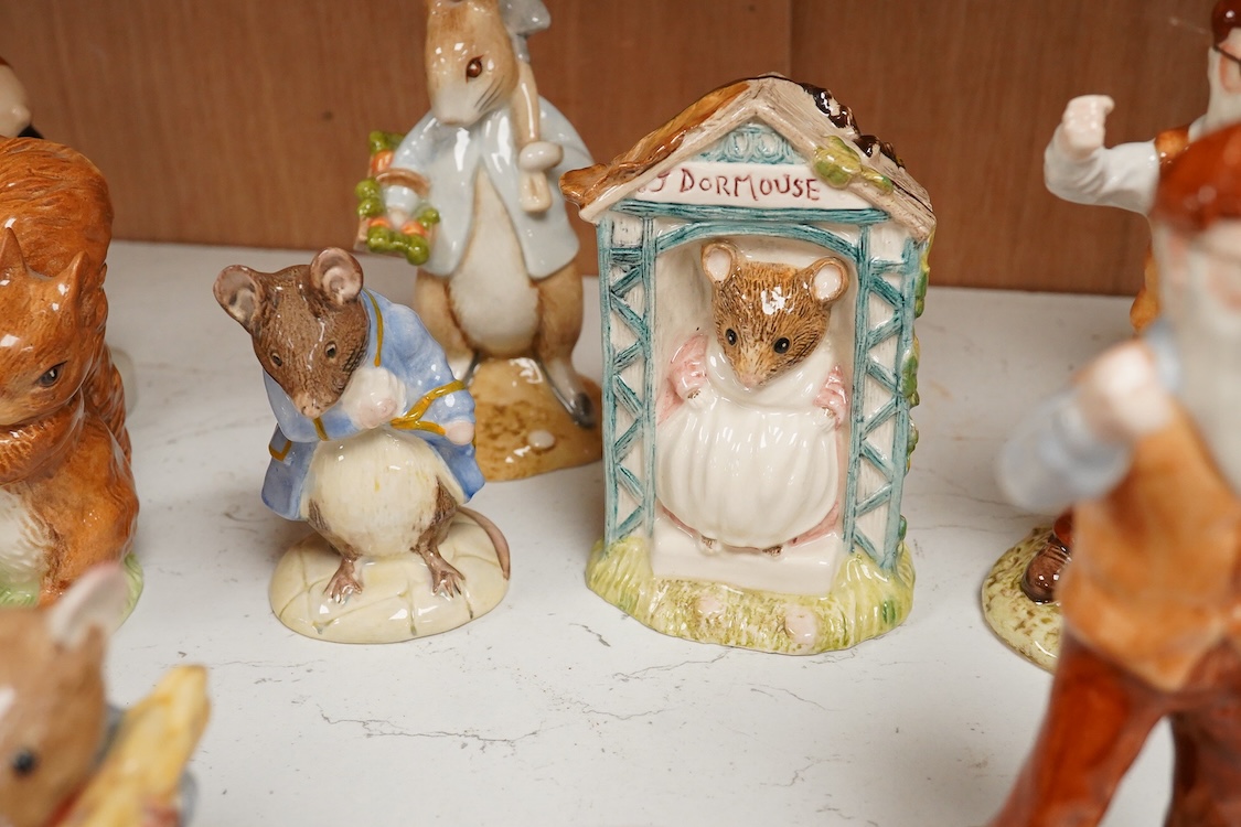 A collection of eighteen mixed Royal Doulton and Royal Albert figures of Beatrix Potter characters, largest 13cm high